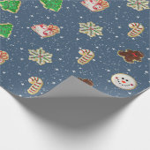 Kerstsuikerkoekjes op sterren cadeaupapier (Hoek)