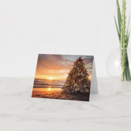 Kerstvakantie boom op het strand bij zonsopgang kaart