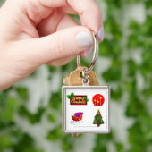 kerstversieringen tegen witte achtergrond sleutelhanger (Hand)