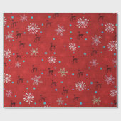 Kerstvreugde en sneeuwvlokken op rood cadeaupapier (Vlak)