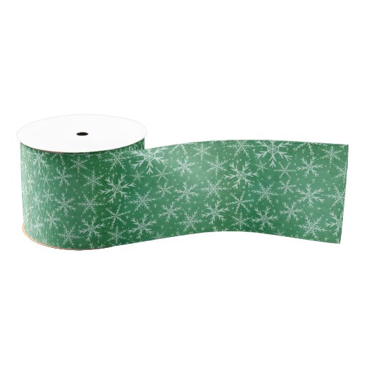 Kerstwintersneeuwvlokken die groen worden grosgrain lint (Spoel)