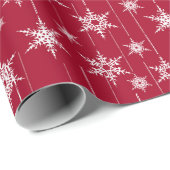 Kerstwitte sneeuwvlokken op rood cadeaupapier (Rol Hoek)