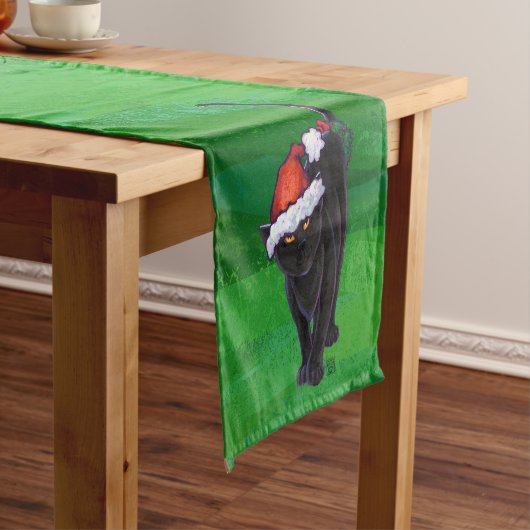 Kerstzwarte kat op groen korte tafelloper (Voorbeeld)