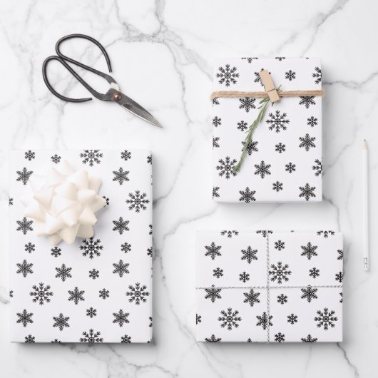 Kerstzwarte sneeuwvlokken op witte achtergrond inpakpapier vel (Voorkant)