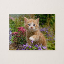 Keukenginger kitten in een tuin legpuzzel