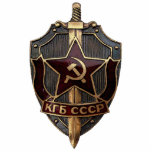 KGB Shield Staand Fotobeeldje<br><div class="desc">Het schild van de beruchte KGB, het apparaat voor staatsveiligheid in de voormalige Sovjet-Unie. De KGB was verantwoordelijk voor interne veiligheid, grensbeveiliging en buitenlandse spionage, alsook voor de tegeninlichtingendiensten.</div>
