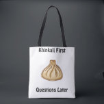 Khinkali Tote Bag<br><div class="desc">Khinkali is a traditional Georgian dish that has become a symbol of Georgian hospitality. These large, hand-crafted dumplings are filled with a savory mixture of minced meat (usually beef and pork), herbs, and spices. The dough is carefully wrapped around the filling, creating a beautiful knot at the top, which also...</div>
