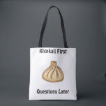Khinkali Tote Bag<br><div class="desc">Khinkali is a traditional Georgian dish that has become a symbol of Georgian hospitality. These large, hand-crafted dumplings are filled with a savory mixture of minced meat (usually beef and pork), herbs, and spices. The dough is carefully wrapped around the filling, creating a beautiful knot at the top, which also...</div>
