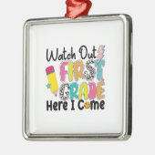 Kijk uit de eerste klas hier. metalen ornament (Links)