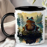 Kikker op rotsbos mok<br><div class="desc">Verrukking in de grillige charme van de Frog on Rock Forest Mok. Deze bijzondere mok heeft een levendig afbeelding van een kikker op een rots in een weelderige bosomgeving, waarbij het ochtendlicht door de bomen filtert. Gepersonaliseerd met jouw naam, voegt het een persoonlijke en speelse touch toe. Deze mok is...</div>