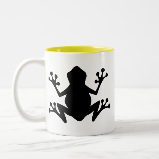 Kikker Silhouette; geel Tweekleurige Koffiemok (Links)