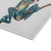 Kikker van de blauwe boom met oogbril op wit snijplank (Hoek)