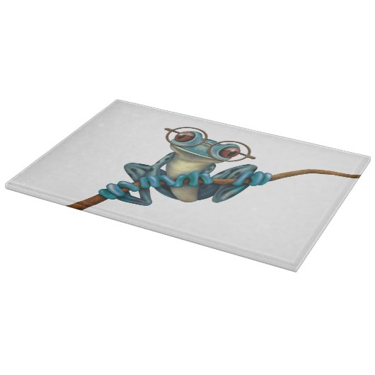 Kikker van de blauwe boom met oogbril op wit snijplank (Hoek)