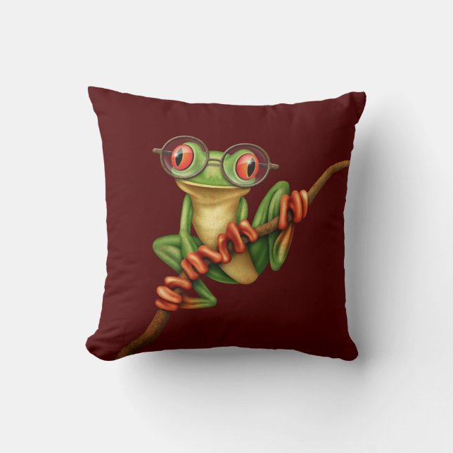 Kikte groene kikker met oogbril op rood kussen (Voorkant)