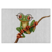 Kikte groene kikker met oogbril op wit snijplank (Voorkant)