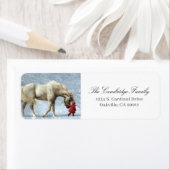 Kind dat een paard leidt in de sneeuwvakantie etiket (Insitu)