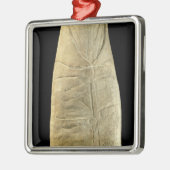 Kind in wasgoed metalen ornament (Links)