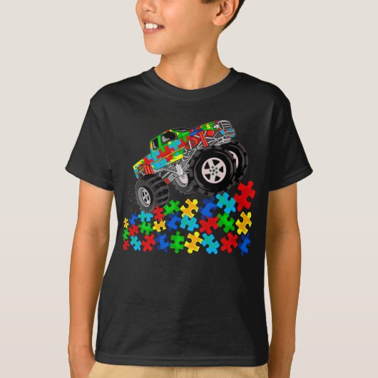 Kinder monstertruck rijdt over puzzels autisme t-shirt (Voorkant)