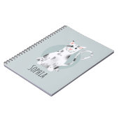 Kinder school voor meisjes met een moderne blauwe  notitieboek (Linkerzijde)