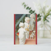 Kinderen die de trap op gaan met kerstmis met een  briefkaart (Staand voorkant)