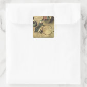 Kinderspelen: detail van een kind met een vierkante sticker (Tas)