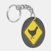 Kip Xing. Sleutelhanger (Voorkant Links)