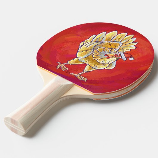Kipkerst op rood tafeltennisbatje (Voorkant Gekanteld)