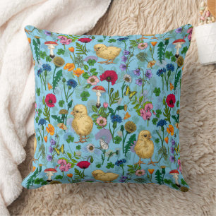 Kippen en wilde bloemen op baby blauw kussen