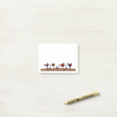 Kippen in een rij post-it® notes (Op bureau)