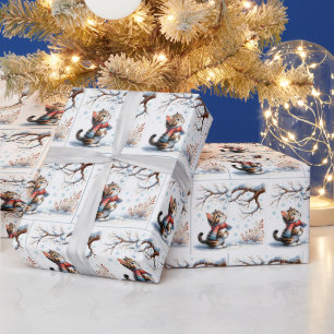 Kitten kijkt naar vallende sneeuw vanaf tak cadeaupapier