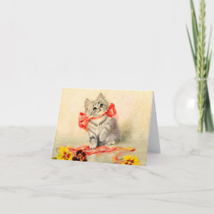 Kitten met een rood lint