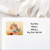 Kitten met een rood lint etiket (Insitu)