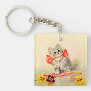 Kitten met een rood lint sleutelhanger