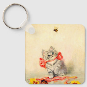 Kitten met een rood lint sleutelhanger