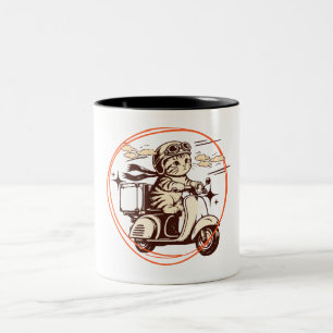 Kitten op een scooter tweekleurige koffiemok