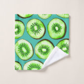 Kiwi snijdsels op turquoise bad handdoek (Wasdoekje)