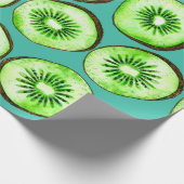 Kiwi snijdsels op turquoise cadeaupapier (Hoek)