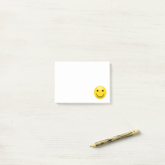 Klassiek eenvoudig gele gezicht post-it® notes (Op bureau)