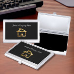 Klassiek huissymbool visitekaarthouder<br><div class="desc">Classy visitekaartjes kaart met een huissymbool op een gouden en zwart embleem dat een vleugje klasse toevoegt. Ontworpen voor een makelaar,  woningbouwer,  schoonmaakdienst of taxateur.</div>