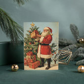 Klassieke  kerstman versierd kerstboom feestdagenkaart