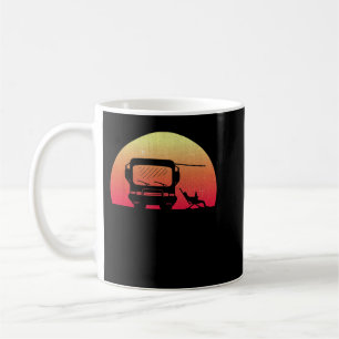 Klassieke Motorhome op zonsondergang met Eigenaar Koffiemok
