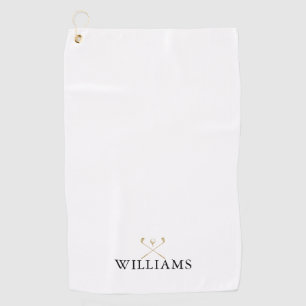 Klassieke zwarte en gouden golfclubs met aangepast golfhanddoek