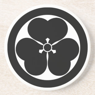 Klaverzuring in cirkel zandsteen onderzetter