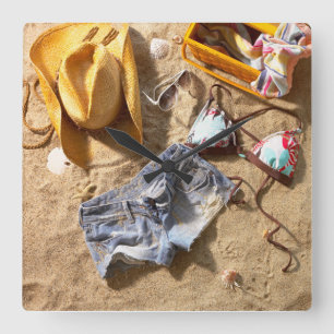 Kleding achter op strand vierkante klok