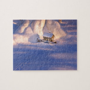 Klein huis in de sneeuwpuzzel legpuzzel