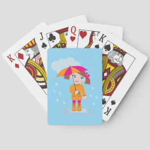 Klein meisje in oranje regenjas met roze paraplu pokerkaarten