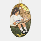 Klein meisje leest in een hammock keramisch ornament (Links)