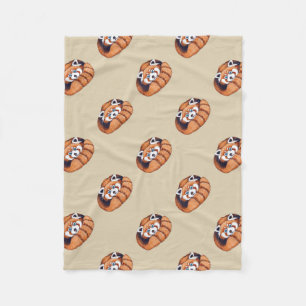 Klein rood beer op bruin fleece deken