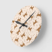 Kleine bruine paarden - op zalmroze. ronde klok (Hoek)