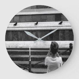 Kleine fotograaf grote klok